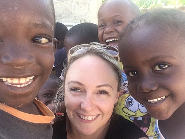 Gill with children in Haiti